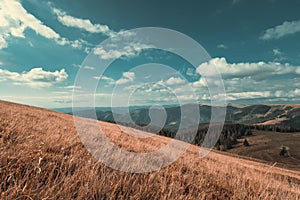 Beautiful mountain landscape in autumn season with yellow grass