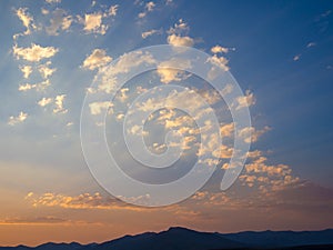 Beautiful mountain landscape with blue orange sky during sunset in the highlands of Lesotho, Southern Africa