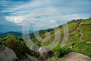 Beautiful mountain landscape with green grass blue sky rock stone. Summer view of the mountain path and valley in Broga Hill, Mala