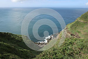 Beautiful mountain landscape of the hiking trail at Bitou Cape with ocean background