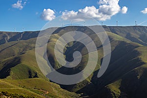 Beautiful mountain landscape, in Serra da Freita, with a wind farm on top of the mountain, located in Arouca Geopark