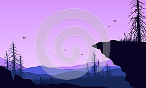 Beautiful mountain panorama from the out of the city at dusk with an aesthetically pleasing silhouette of trees. Vector