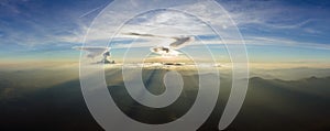 Beautiful mountain panoramic landscape with hazy peaks and foggy valley at sunset