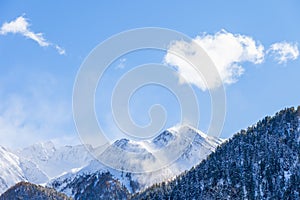Beautiful mountain peaks with snow and a blue clear sky