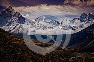 Beautiful mountain range covered by cloud along the way to EBC (Nepal, Himalaya)