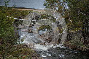 A beautiful mountain river rapids in mountains of Folgefonna National park in Norway.