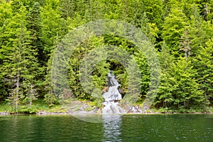 Beautiful mountain river stream. Sunny nature background of river and rocks