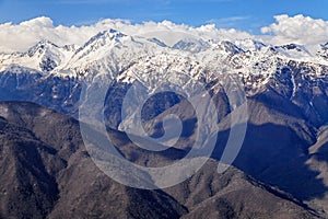 Beautiful mountain scenery of the Main Caucasian ridge with snowy peaks at late fall