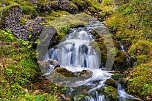 Beautiful mountain stream in the Dolomites photo