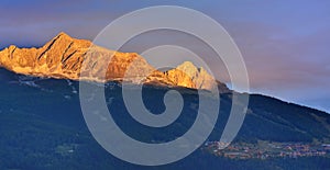 Beautiful mountain at sunset above alpine village