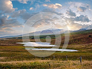 Beautiful mountain view during auto trip in Iceland. Spectacular Icelandic landscape with  scenic nature: mountains, fields,