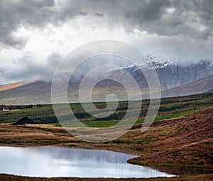 Beautiful mountain view during auto trip in Iceland. Spectacular Icelandic landscape with  scenic nature: mountains, fields,