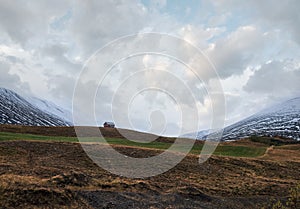 Beautiful mountain view during auto trip in Iceland. Spectacular Icelandic landscape with scenic nature: mountains, fields,