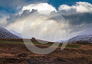 Beautiful mountain view during auto trip in Iceland. Spectacular Icelandic landscape with scenic nature: mountains, fields,