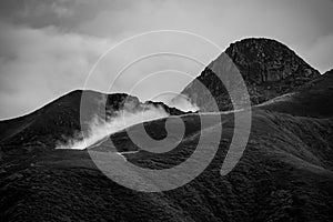 A beautiful mountain view with fog and clouds