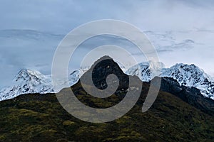 A beautiful mountain view with fog and clouds