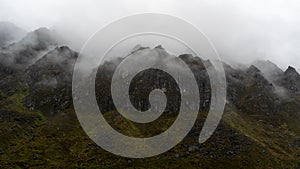 A beautiful mountain view with fog and clouds