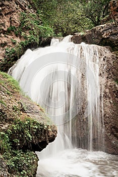 Beautiful mountain waterfall captured with motion blur