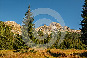 Beautiful mountains during the autumn season with dry grass, beautiful blue skies and deep valleys.