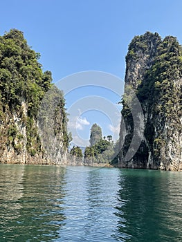 Beautiful mountains lake river sky and natural attractions in Ratchaprapha Dam at Khao Sok National Park