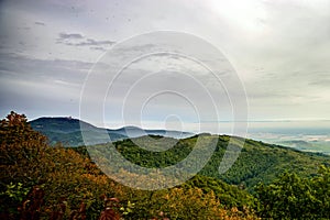 Beautiful mountains landscape from the top of the hill with fog