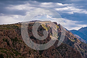 Beautiful mountains with plateau ending with rocky cliff. Mountain valley landscape. Travel concept. Kora river mountain gorge.