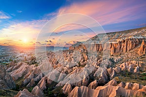 Beautiful mountains and Red valley at sunset in Goreme, Cappadocia in Turkey. photo