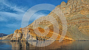 Beautiful mountains reflected in the water. Fjords on the Musandam peninsula. Khasab. Oman