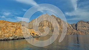 Beautiful mountains reflected in the water. Fjords on the Musandam peninsula. Khasab. Oman