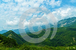 beautiful mountains, summer landscape, clouds, forest on the hillsides