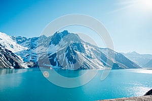 Beautiful mountains and tourquiose water of Embalse Del Yeso Dam photo