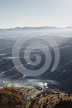 Beautiful mountains view in the morning. Autumn foggy landscape