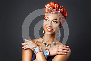 Beautiful mulatto young woman with turban on head