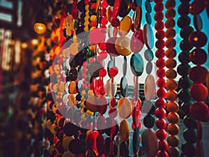 Beautiful multi-colored bead curtains under the lights