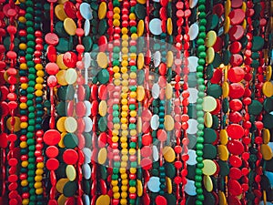 Beautiful multi-colored bead curtains under the lights