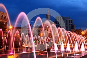 Beautiful multi-colored fountain in the city Dnepr at night (Dnepropetrovsk), Ukraine.