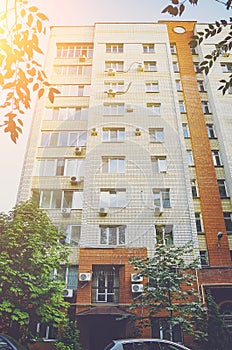 A beautiful multi-storey house of red and white brick, elements of a modern new residential building