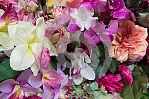 Beautiful multicolored artificial handmade flowers background.