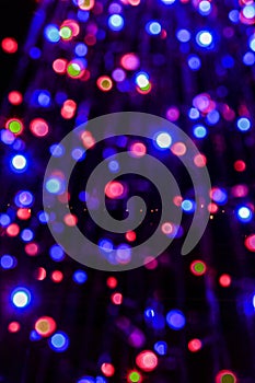 Beautiful multicolored bokeh of holiday lights at night.