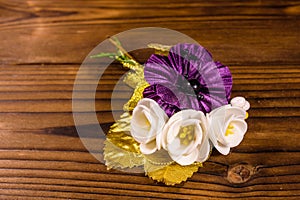 Beautiful multicolored brooch on a wooden table