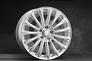 beautiful multipath alloy wheel 18 diameter silver color on a dark background. tuning auto parts for a car.