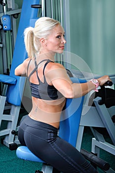 Beautiful muscular woman exercise in a gym