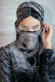 Beautiful Muslim Arabic girl with paranja, only eyes