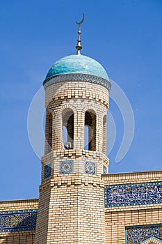 Beautiful muslim mosque on a sunny day against blue sky