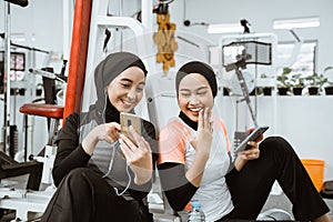 beautiful muslim sporty woman taking a break after exercising