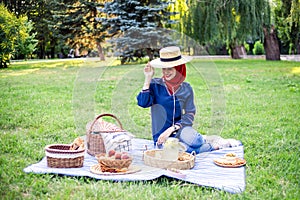 Beautiful Muslim woman on picnic at sunny day.