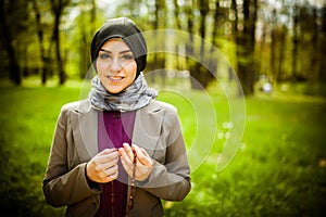 Beautiful muslim woman wearing hijab praying on rosary / tespih