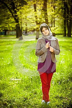 Beautiful muslim woman wearing hijab praying on rosary / tespih