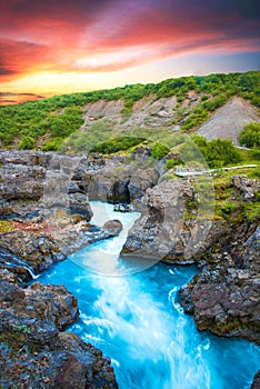 Beautiful mystical landscape with river in canyon Kolugljufur  between the rocks in Iceland at red dawn. Exotic countries. Amazing