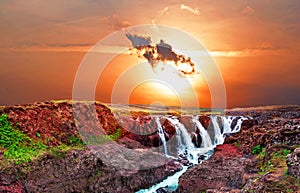 Beautiful mystical landscape with scorpion-shaped cloud over canyon Kolugljufur with water between the rocks in Iceland. Exotic